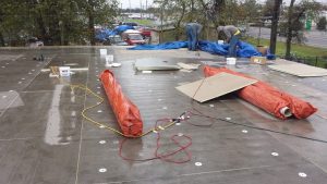 commercial roofing in the rain, Dowell Roofing, Murfreesboro Roofers